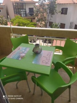 balcony with table and chairs
